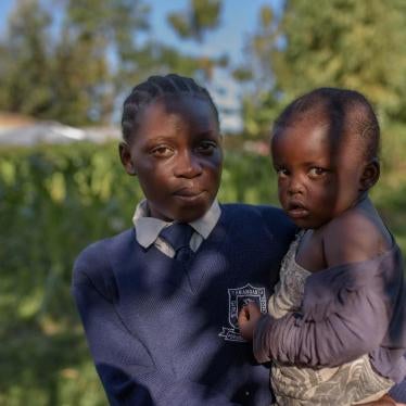 “Evelina,” 17, with her 3-year-old daughter “Hope,” in Migori county, western Kenya. Evelina is in Form 2, the second year of lower secondary school.