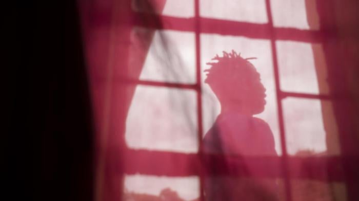 A young transgender woman at a friend’s house seeking temporary shelter in Lilongwe, Malawi. 