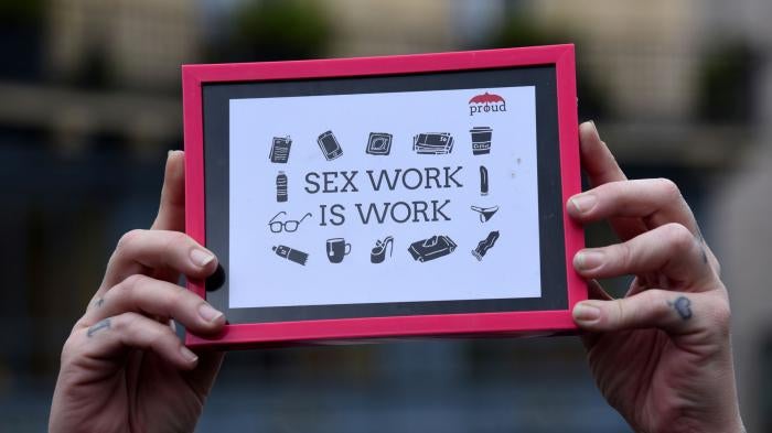 People demonstrate in support of sex workers, April 14, 2018. 