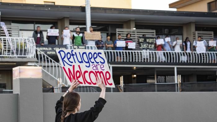 Asylum seekers and human rights activists protest against the detention of refugees amid the Covid-19 crisis in Brisbane.