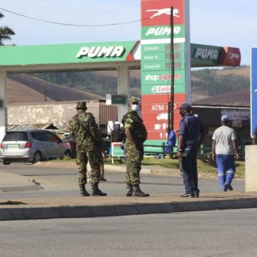 Eswatini soldiers and police officers are seen on the streets near the Oshoek Border Post between Eswatini and South Africa on July 1, 2021.