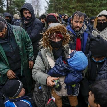 Migrants wait in freezing temperatures near the Bruzgi checkpoint on the Polish-Belarusian border November 18, 2021 in Grodno, Belarus. 