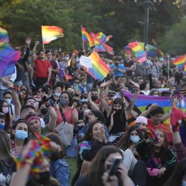 Chileans celebrate after lawmakers passed legislation legalizing marriage for same-sex couples, in Santiago, Chile, Tuesday, Dec. 7, 2021. (AP Photo/Esteban Felix).