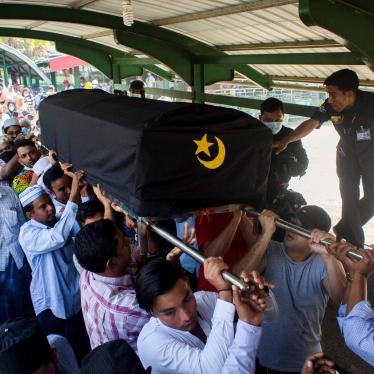 People attend the funeral of Khin Maung Latt