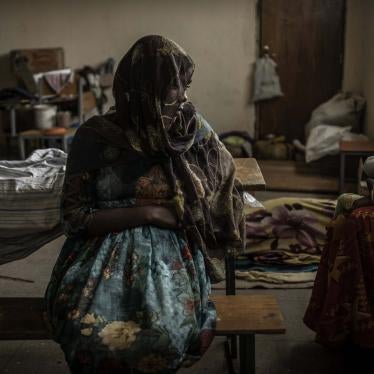 A woman sits at a school being used to house people displaced by fighting, in the city of Mekelle in Ethiopia's northern Tigray region.