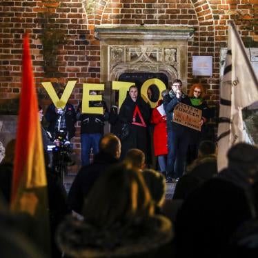 People attend a “Stop Lex Czarnek” protest at the Main Square in Krakow, Poland. 