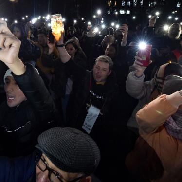 Protesters flash the light of their mobile phones during a rally for freedom of speech and freedom for political prisoners in Bishkek, Kyrgyzstan, on November 25, 2022. 