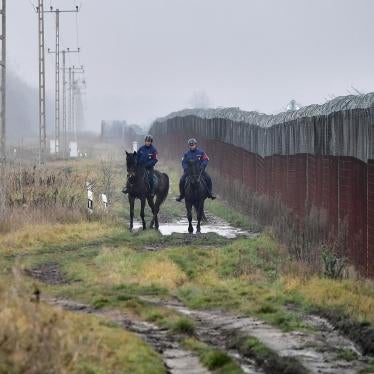 Police patrol the Hungarian-Serbian border barrier near Kelebia, Hungary, December 15, 2022. 