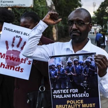 Activists hold posters and chant to pay tribute to the assassinated Eswatini, formerly Swaziland, Human Rights Lawyer Thulani Maseko in Nakuru Town, January 30, 2023. 