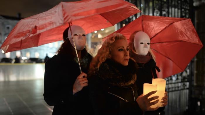 Kate McGrew and other members of Sex Workers Alliance Ireland hold a candlelit vigil outside Leinster House in Dublin, Ireland to mark International Day to End Violence against Sex Workers, December 17, 2014.