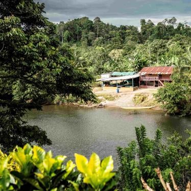 View of a river and building on a rural hillside