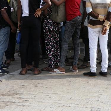 Men charged with public displays of same-sex affection gather within the premises of the Federal High Court in Lagos, Nigeria, March 3, 2020. 