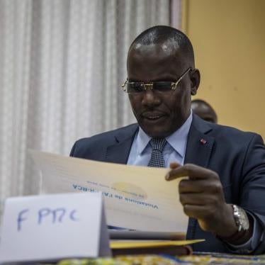 Abdoulaye Hissene, one of the leaders of the FPRC (Popular Front for the Rebirth of Central African Republic) armed group, reads a report on the breaches of the Khartoum agreements by armed groups, in Bangui, on August 23, 2019. 