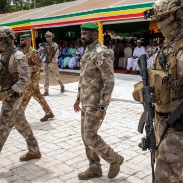 The leader of Mali’s junta, Lt. Col. Assimi Goita, center, attends an independence day military parade on September 22, 2022, in Bamako, Mali. 