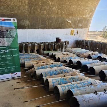 Stockpiled cluster munitions and their submunitions being prepared for destruction.