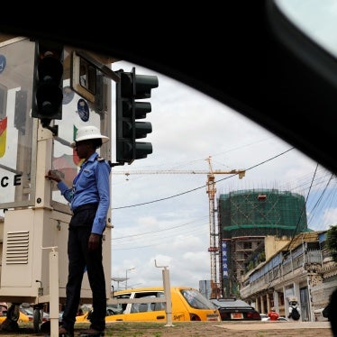 A traffic policewoman stands in downtown Yaounde, Cameroon, October 9, 2018.