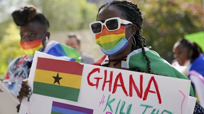 A demonstrator attends a rally against a controversial bill being proposed in Ghana's parliament that would make identifying as LGBTQIA or an ally a criminal offense punishable by up to 10 years in prison, Harlem, New York, October 11, 2021. 