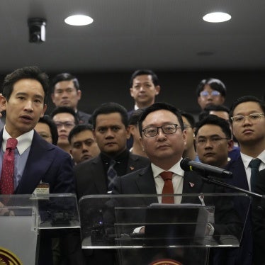 Former leader of the Move Forward Party Pita Limjaroenrat, left, and the party's current leader Chaithawat Tulathon speak at a news conference