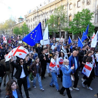 Protesters march outside the parliament building in protest of “the Russian law” in Tbilisi, Georgia, April 9, 2024. 