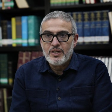 Dr. Ghassan Abu Sittah, a Palestinian-British plastic surgeon specializing in conflict medicine, speaks during an interview at the Institute for Palestine Studies in Beirut, Lebanon, December 9, 2023. © 2023 AP Photo/Hussein Malla