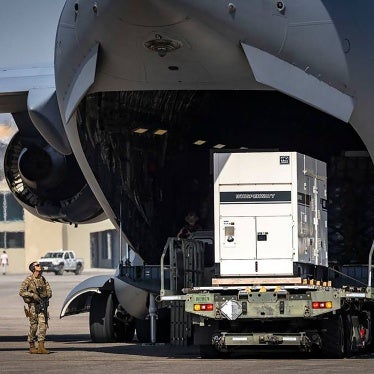 Supplies are offloaded from a U.S. Air Force C-17 cargo plane on the tarmac at Toussaint Louverture International Airport in Port-au-Prince, Haiti. The plane was carrying supplies for the camp being built for Kenyan police officers who will lead a Multinational Security Support mission into Haiti, May 15, 2024. 