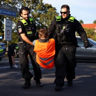 Police officers remove an activist of the "Letzte Generation" as they protest for climate action in Berlin, Germany September 28, 2023. 