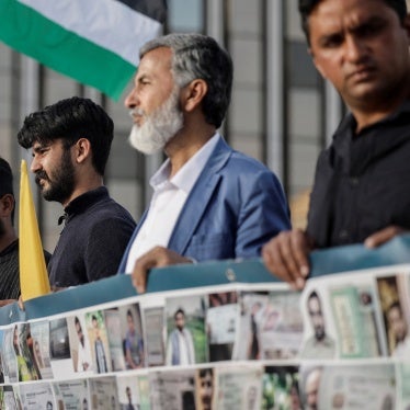 Two survivors of the deadly Pylos shipwreck along with supporters participate in a protest calling for justice in Athens, Greece, May 20, 2024.