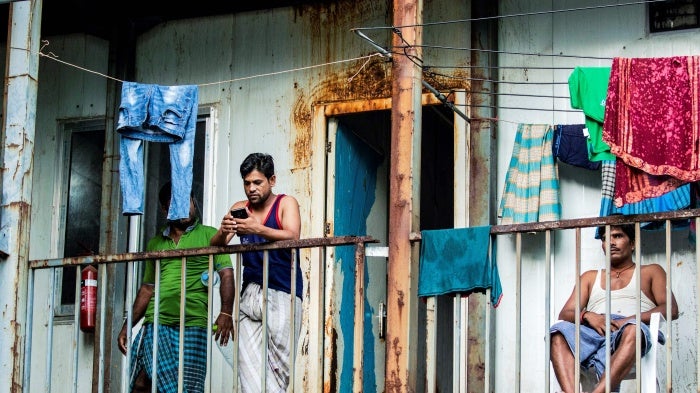 Workers from Bangladesh gathering in their accommodation block in Malé, Maldives, May 9, 2020. 