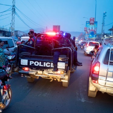 Police car driving through Goma, Democratic Republic of Congo