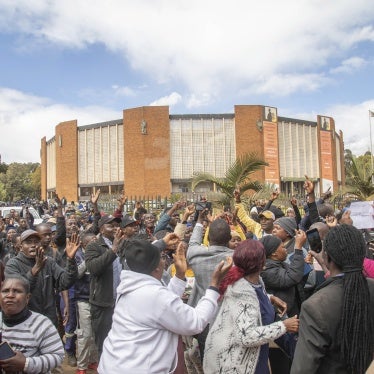 Opposition supporters protest outside a court, in Harare, Zimbabwe