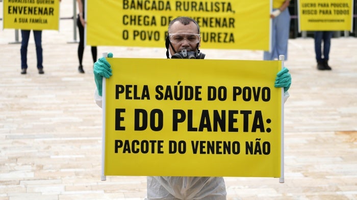 Activists protest the use of pesticides outside the National Congress in Brasilia, Brazil, on October 4, 2023. 