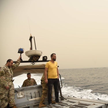 Men on a military boat at sea