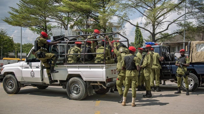 Tanzanian police officers patrol the streets ahead of a demonstration over the alleged kidnapping and killing of opposition party members, Dar es Salaam, September 23, 2024. 