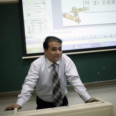 Economist Ilham Tohti, from China's predominantly Muslim Xinjiang region, speaks to students at the Central Nationalities University in Beijing, China, December 1, 2009.