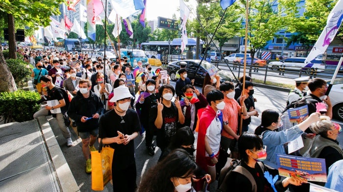 Members of the LGBTQ+ community march towards the new presidential office during a protest ahead of the International Day Against Homophobia, Transphobia and Biphobia, in Seoul, South Korea, May 14, 2022.