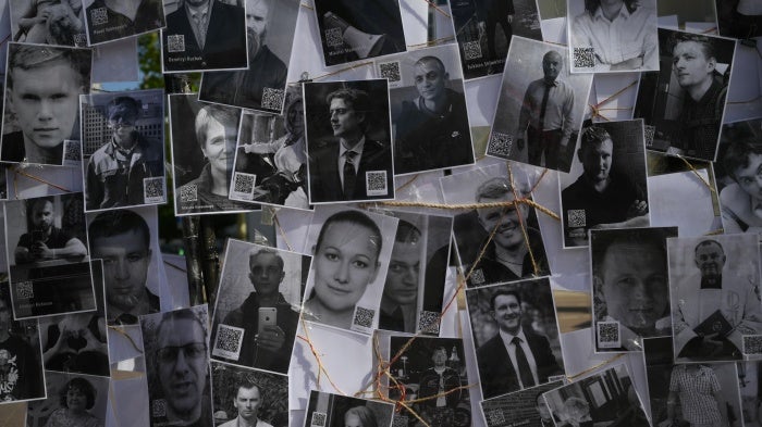 A collage of photos portrays some of the hundreds of political prisoners currently detained in Belarus, displayed during a demonstration in Warsaw, Poland, May 18, 2024.