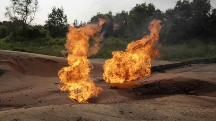 A burning flare is visible at an oil extraction area located in Moanda, Democratic Republic of the Congo, December 23, 2023.