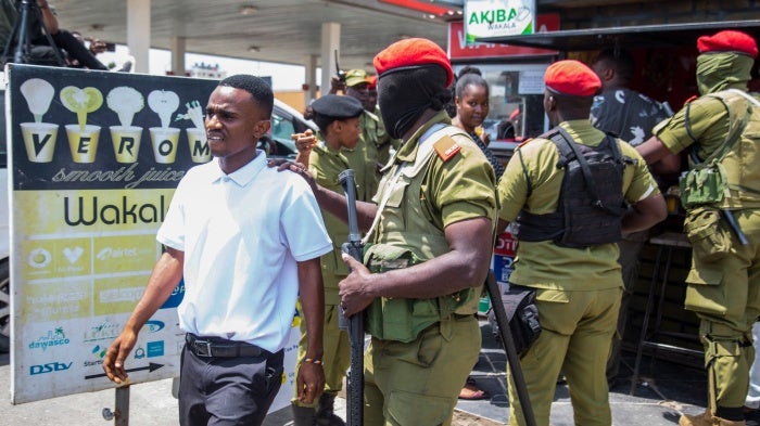 Police detain a supporter of Tanzania’s main opposition party, Chadema, at the start of a banned protest in Dar es Salaam, September 23, 2024.