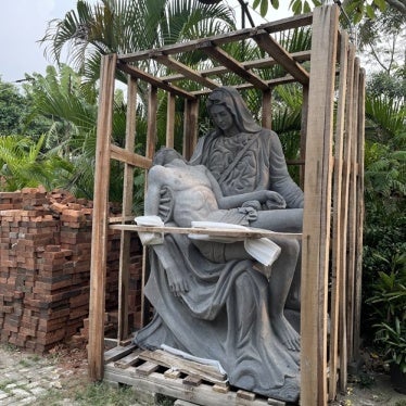 A statue of Mother Mary and Jesus, still inside a crate in the parish of St. Joannes Baptista in Parung.