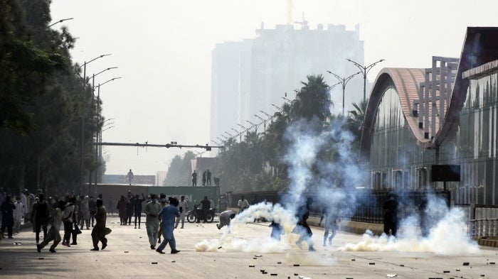 Police officers fire tear gas to disperse the supporters of imprisoned former Prime Minister Imran Khan's Pakistan Tehrik-e-Insaf party, during a protest in Islamabad, Pakistan, October 5, 2024.