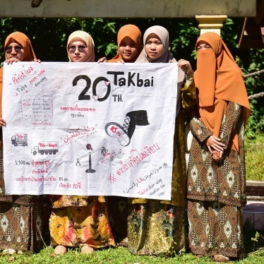 Community members call for justice at a mass grave for victims of the October 2004 Tak Bai massacre, Narathiwat, Thailand, October 25, 2024.