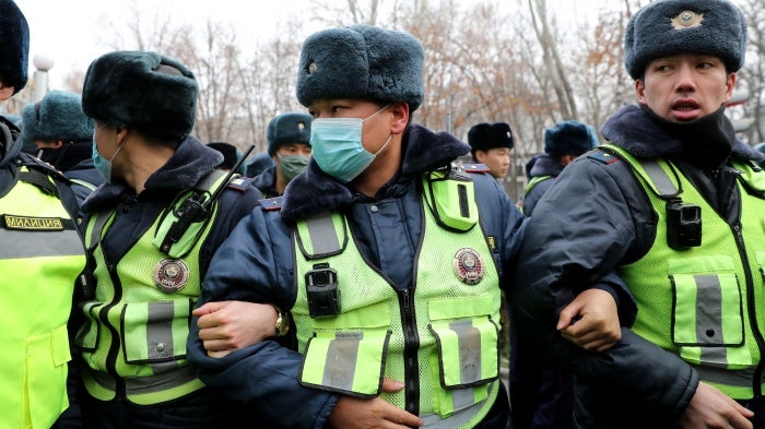 Police are deployed as people gather in support of a detained journalist, outside the Ministry of Interior Affairs in Bishkek, Kyrgyzstan, January 23, 2022. 