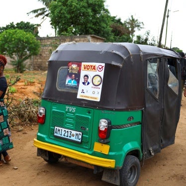 A woman speaks on a mobile phone.