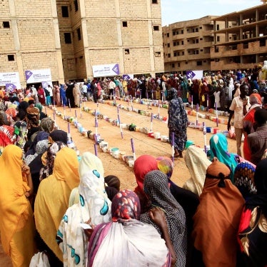 Displaced people gather to receive free breakfast meals at a neighborhood in Omdurman city, Sudan, August 1, 2024. 