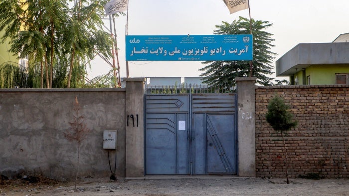 The Taliban flag flies over a National Radio Television of Takhar (RTA) building in Talogan, Afghanistan, on October 15, 2024.