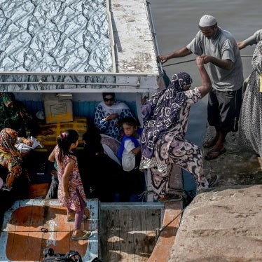 A group of women travel during a heatwave for medical consultation to the only midwife who arrives from the mainland to Baba Island along the Karachi Harbor, Pakistan, June 11, 2024.