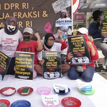 Activists during a protest and hunger strike demanding that parliament to pass a bill to protect domestic workers, at the parliament in Jakarta, Indonesia, August 14, 2023.