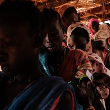 A woman has her arm measured during a malnutrition checkup at a medical center in a camp for internally displaced persons in South Kordofan state, Sudan, on June 17, 2024. 