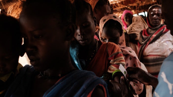 A woman has her arm measured during a malnutrition checkup at a medical center in a camp for internally displaced persons in South Kordofan state, Sudan, on June 17, 2024. 