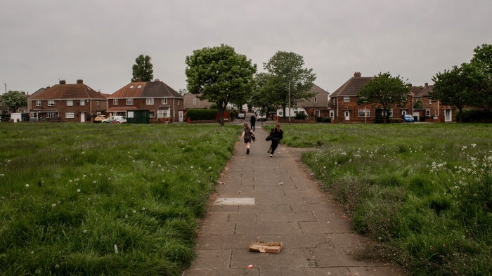 Children play in a park on a housing estate in Redcar, Teesside, May 17, 2023.